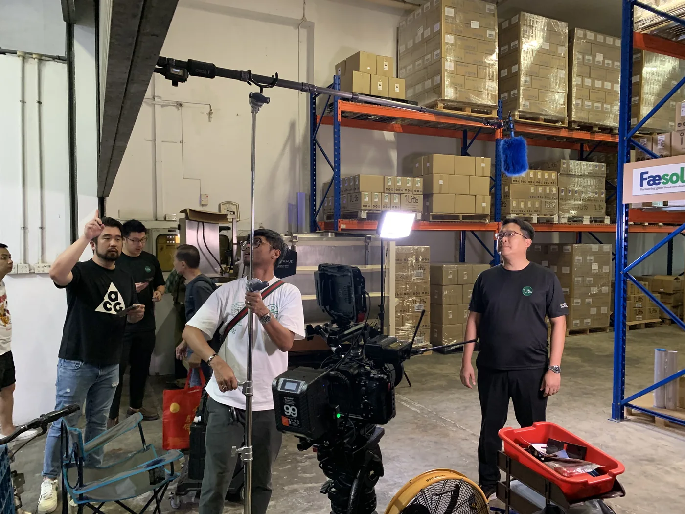 Red Ink crew filming in Faesol's industrial setting.