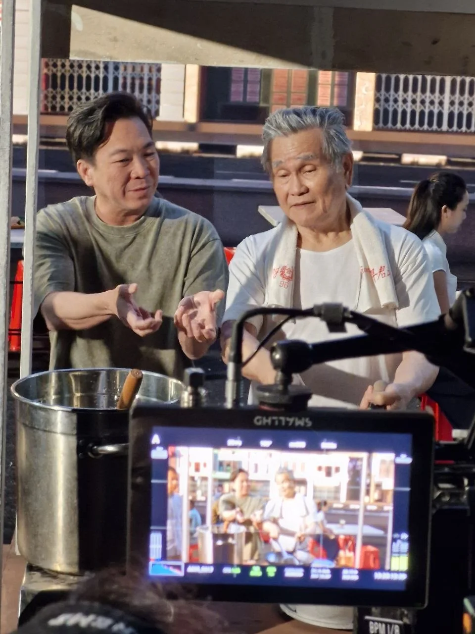 Gilbert directing a scene on set.